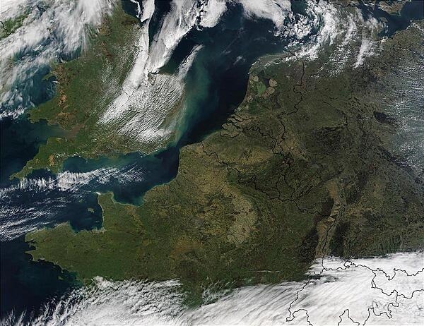 This satellite photo shows the Strait of Dover in Northwest Europe. Visible are the Republic of Ireland (top leftmost), the United Kingdom (top left), France (middle left), Belgium (middle), the Netherlands (top middle), Germany (right), Denmark (top right), Luxembourg (between France, Germany, and Belgium), Switzerland (bottom middle), Italy (bottom middle), and Austria (bottom right); the last three are all cloud-covered. Image courtesy of NASA.