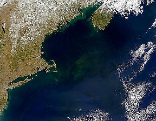 A view of Georges Bank, a large elevated area of the sea floor that separates the Gulf of Maine from the Atlantic Ocean. The Bank is situated east of Cape Cod, Massachusetts (US is on the left) and southwest of Cape Sable Island, Nova Scotia (Canada is upper-right). Photo courtesy of NASA.