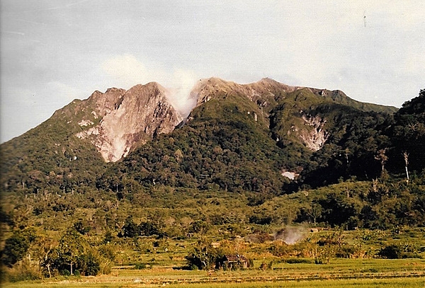 Evidence of tectonic activity: a dormant but smoking volcano on the island of Sumatra in Indonesia.