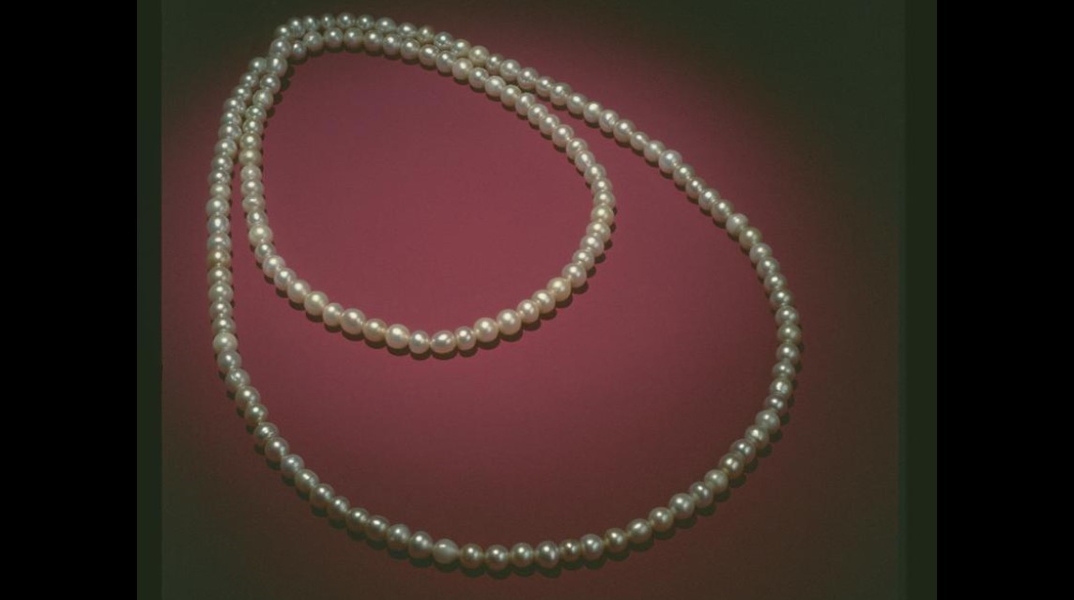 Following President Martin Van Buren’s signing of a Treaty of Friendship and Commerce in 1840 with the Sultanate of Oman, the Imam of Muscat presented him with 148 pearls as token of gratitude.  The pearls, originating from the Persian Gulf, were fashioned into a necklace for the president’s daughter-in-law who was the acting first lady since Van Buren was a widower.  Upon leaving office, the president returned the pearls to the United States Government and they are on display in the First Ladies Exhibit in the Smithsonian National Museum of American History.  Pearls are unique among gems as they are the only one formed entirely within a living creature-an oyster. Natural pearls occur when an irritant enters the oyster’s shell and the mollusk protects itself from the foreign body by secreting layers of nacre. The formation of a cultured pearl utilizes the same process with the exception that a shell bead is surgically implanted into the oyster to induce nacre production. (Photo courtesy of the Smithsonian Museum of Natural History)