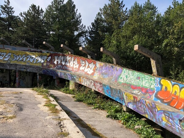 Trebevic Mountain, located outside Sarajevo in Bosnia-Herzegovina, was the site of many 1984 Winter Olympics events. During the 1,425-day Siege of Sarajevo, Trebevic was heavily mined, and its elevation provided an ideal position for snipers and artillery units attacking Sarajevo. After lengthy restoration work, the mountain was declared a national park and reopened to the public in 2017. The restored graffiti-covered bobsleigh track is a cultural landmark and beloved by admirers of street art the world-over.