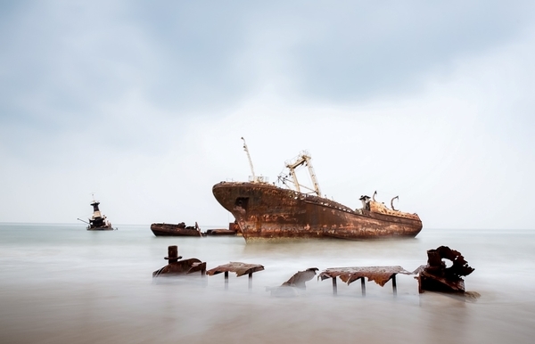 Located some 30 km north of Luanda, Angola's capital, is 2.5 km-long Shipwreck Beach. The area acquired its name in the 1970s when bankrupt companies towed their old ships to this remote beach, forming a ship graveyard. The ships date back to the 1960s; the largest of the more than 20 rusting hulks is an oil tanker named "Karl Marx."