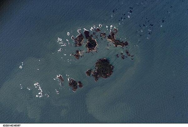 The Isles of Scilly, an archipelago of approximately 150 islands, are located some 45 km (28 mi) southwest of the westernmost point of England (Land&apos;s End). Only five of the islands are currently inhabited. Image courtesy of NASA.