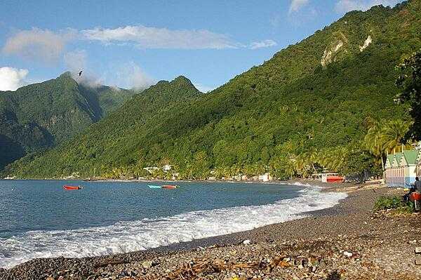 View of the south side of the island. Dominica features lush mountainous rain forests and is the home of many rare plant, animal, and bird species, including the Sisserou parrot featured on its flag.