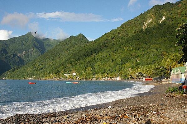 View of the south side of the island. Dominica features lush mountainous rain forests and is the home of many rare plant, animal, and bird species, including the Sisserou parrot featured on its flag.