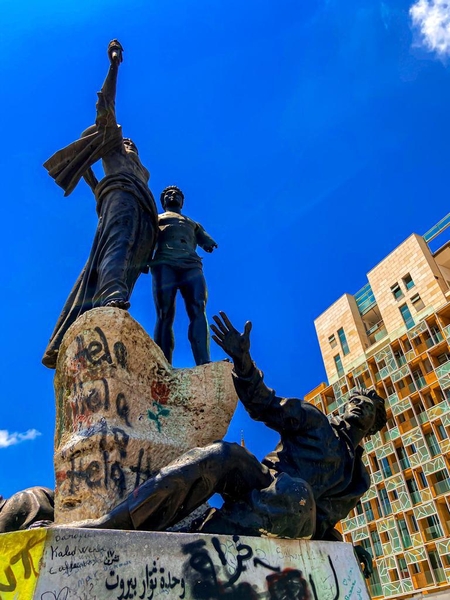 The Martyr’s Monument, located in Martyr’s Square in downtown Beirut, honors the 6 May 1916 hanging of a cross-confessional group of Lebanese patriots who spoke against the Turkish rule of Ottoman General Jamal Pasha. Dedicated in 1960, the four-meter-high (13 ft) statue of the Martyrs was dismantled in 1996 due to damage sustained during the Lebanese Civil War (1975-90); it was restored with the marks of war damage intentionally preserved.