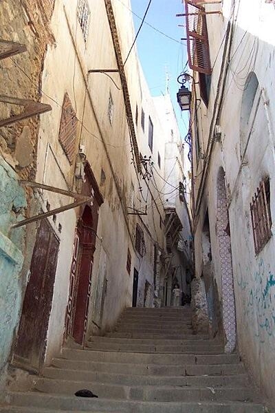 The modern city of Algiers lies near the Mediterranean coast of Algeria, while the older city is on a steep hill crowned by the Casbah, or Citadel. This view is of a typical Casbah stairway.