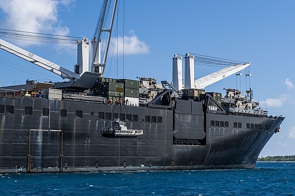 The USNS Seay (T-AKR 302), a Military Sealift Command roll-on/roll-off vehicle cargo ship,  at anchor in the lagoon at Diego Garcia in the British Indian Ocean Territory. The photo shows sailors lowering a maritime prepositioning force utility boat from the USNS Seay using a crane during a ship-to-shore logistics training exercise. Photo courtesy of the US Navy/ Mass Communication Specialist 1st Class Nathan Carpenter.