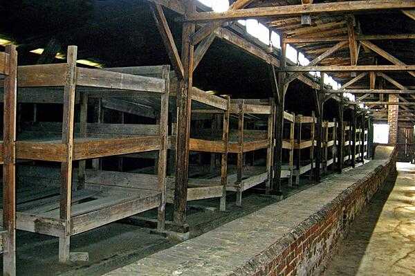 Barracks at the Auschwitz II (Birkenau) concentration camp. The camp and surrounding satellite camps were built by Nazi Germany in occupied Poland during World War II. Following the war, the Polish Government established a memorial museum to honor the more than 1 million victims who died at the camp.