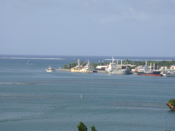 The harbor on Pohnpei in Micronesia. In the background is the surf line along the outer reef.