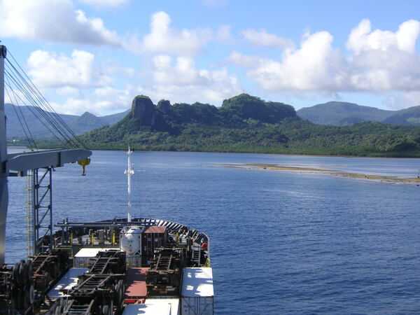 The entrance channel to Pohnpei harbor in Micronesia, with Paipalap Peak (Sokehs Rock) in the background.