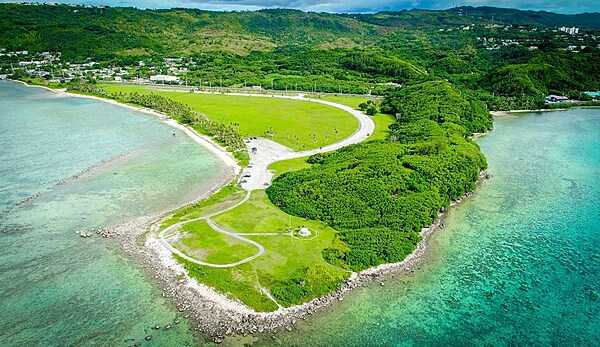 Aerial view of Asan Ridge and the War in the Pacific National Historical Park on Guam. Established in 1978, the park is composed of various sites on the western shore of the island. During the Second World War, Japanese forces captured Guam in 1941, and the Americans liberated it in 1944. The park includes former battlefields, gun emplacements, trenches, caves, and historic structures. Photo courtesy of the US National Park Service.