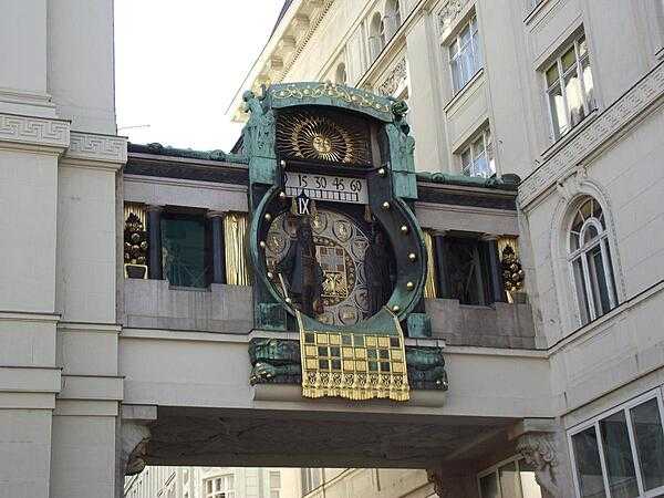 The unique Ankeruhr (Anker Clock) was built by the Anker Insurance Company in 1914 and forms a bridge between two buildings overlooking the oldest square in Vienna, Austria. The square is part of Vienna’s historic city center, which is a UNESCO World Heritage site. The Art Nouveau-style Ankeruhr is adorned with mosaic ornaments and 12 historical figures that move across the bridge every 12 hours. At noon, all the figures parade to music. The work was commissioned as a contribution to the city’s art and culture but also as a subtle reminder of the importance of life insurance, with allegorical motifs representing the passage of time and the transience of human existence.