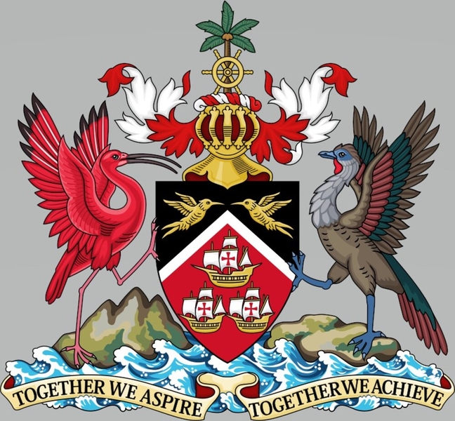 Designed in 1962, Trinidad and Tobago’s coat of arms incorporates historical and indigenous elements, as well as national symbols. The scarlet ibis (national bird of Trinidad) and the cocrico (national bird of Tobago) support a shield displaying two hummingbirds – Trinidad is home to 18 species of the bird and is called the “Land of Hummingbirds.” Three gold ships on a backdrop of national colors represent Christopher Columbus, who visited the islands. The three peaks in the lower left refer to Trinidad being named after the Holy Trinity and also represent a famous mountain. The image of a gold ship's wheel in front of a coconut palm was also used on the Great Seals of British Colonial Tobago. The gold helmet represents Queen Elizabeth II of England (ruler of the country at the time), and the national motto promotes harmony in diversity.