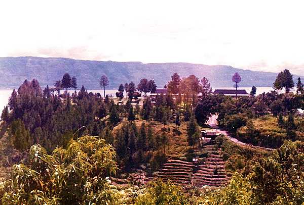 Lake Toba is located in the middle of the northern part of the island of Sumatra, occupying the caldera of a supervolcano. The lake is about 100 km (62 mi) long, 30 km (19 mi) wide, and up to 505 m (1,657 ft) deep. It is the largest lake in Indonesia and the largest volcanic lake in the world. 
Lake Toba is the site of a supervolcanic eruption estimated at a Volcanic Explosivity Index (VEI) of 8, the largest recorded value on the index. Recent advances in dating methods suggest the date was 74,000 years ago and that it represented a climate-changing event. It is the largest-known explosive eruption on earth in the last 25 million years.