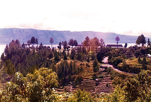 Lake Toba is located in the north of the island of Sumatra, Indonesia, and occupies the caldera of a supervolcano. The lake is about 100 km (62 mi) long, 30 km (19 mi) wide, and up to 505 m (1,657 ft) deep. It is the largest lake in Indonesia and the largest volcanic lake in the world.