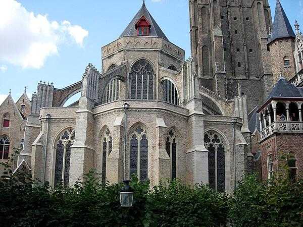 The Church of Our Lady in Bruges (or Brugge), Belgium. Built between the 13th and 15th centuries, it contains both Romanesque and Gothic features, and its 122 m (401 ft) spire makes it the tallest structure in the city.