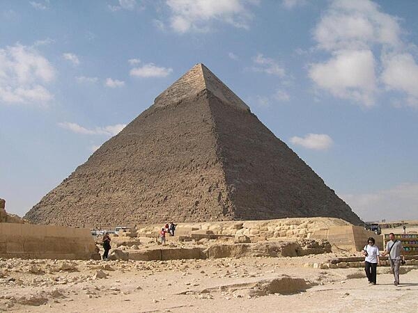 The Pyramid of Khafre is the second largest pyramid of Giza, near Cairo, Egypt. Smooth casing stones still cover most of the upper portion of the pyramid.