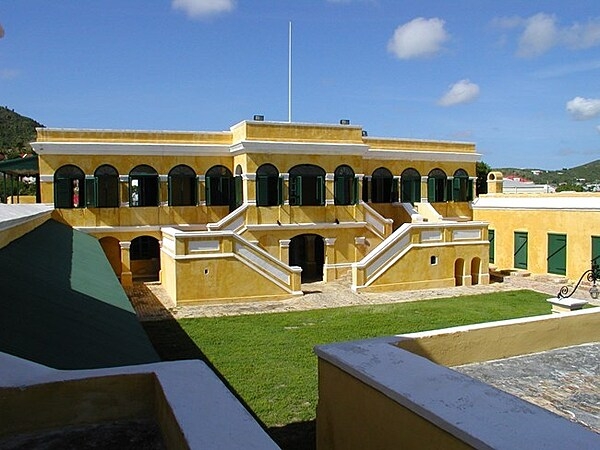 The Commandant's Quarters at Fort Christiansvaern in Christiansted, St. Croix. The building is part of the Christiansted National Historic Site, which preserves 18th and 19th century structures relating to urban colonial development in the Virgin Islands. The site is in the heart of Christiansted, the capital of the former Danish West Indies on St. Croix Island. Photo courtesy of the US National Park Service.