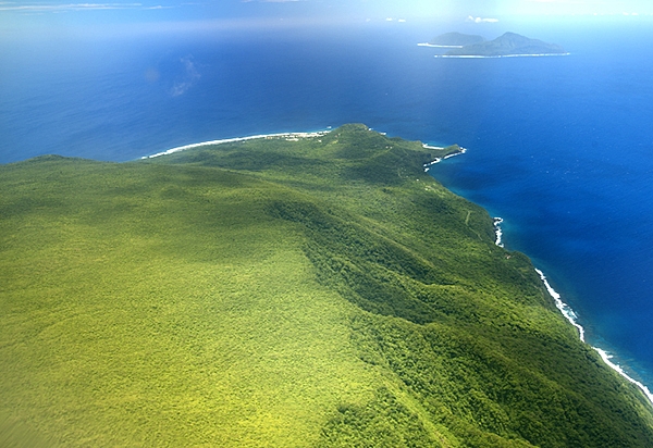 The sparsely populated Manu'a Islands are 100 km (60 mi) east of Tutuila in American Samoa; they include the volcanic islands of Ofu and Olosega (far distance), and Ta'u (foreground). Photo courtesy of the US National Park Service.