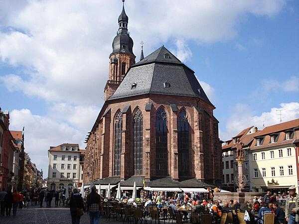 The Heiliggeistkirche (Church of the Holy Spirit), constructed between 1398 and 1515, is the largest church in Heidelberg, Germany, and among the most visited churches in the country. Originally a Roman Catholic church, it changed denominations frequently over the centuries, and at one point, the nave and choir of the church were separated by a wall to allow Catholics and Protestants to worship at the same time. The wall was removed in 1936, and the church became solely Protestant.