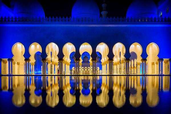 The Sheikh Zayed Grand Mosque is located in Abu Dhabi, the capital city of the United Arab Emirates. The largest mosque in the country, it is the key place of worship for daily prayers. During the Muslim festival of Eid, it has been visited by more than 41,000 people in the period of celebration.
Constructed between 1996 and 2007, the Grand Mosque contains design elements borrowed from other Islamic countries, including Turkey, Morocco, Pakistan, and Egypt. Its main axis is rotated about 11° south of true west, aligning it in the direction of the Kaaba in Mecca, Saudi Arabia. Natural materials, such as marble, gold, semi-precious stones, crystals, and ceramics were used in construction due to their long-lasting qualities.