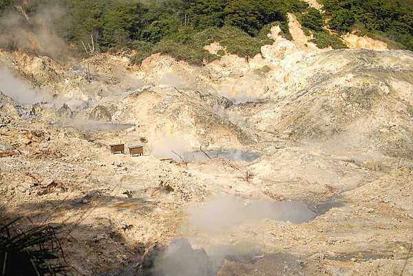 Sulfur Springs is billed as the world's only drive-in volcano. The two boxes house monitoring devices that keep track of seismic activity.