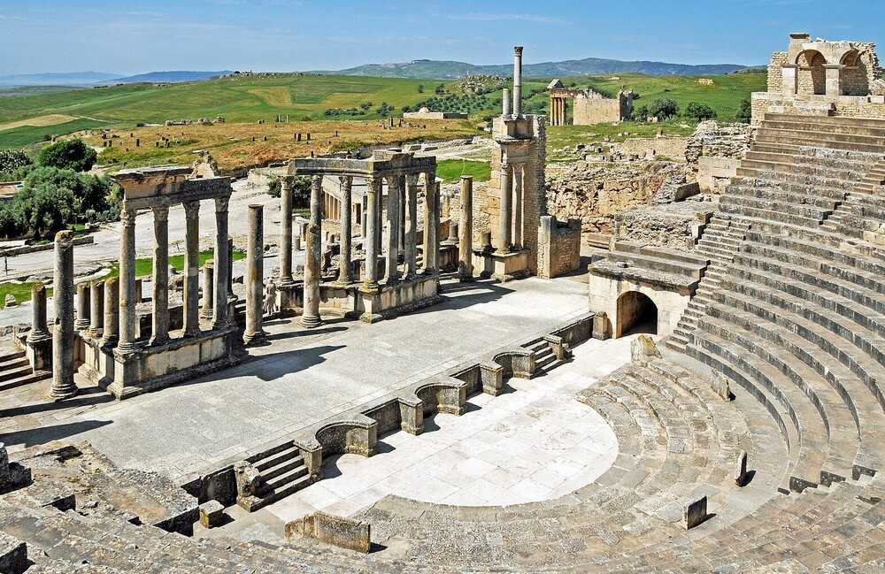 This ancient theater in Tunisia is located in Dougga, one of the best-preserved Roman towns in North Africa. The 75 ha (190-acre) archaeological site was built between AD 168 and 169. The theater seats 3,500 and today is home to the annual International Festival of Dougga, celebrating music and the performing arts.