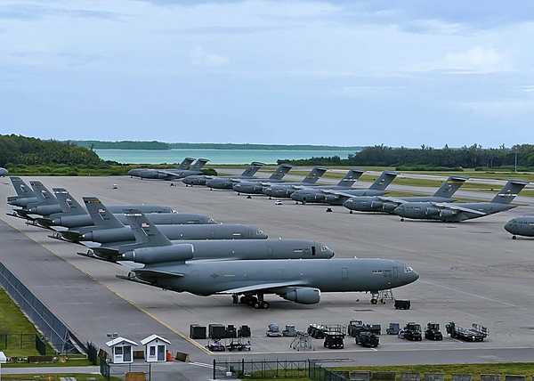 US Air Force KC-10A Extender aerial refueling aircraft, left, and C-17 Globemaster III cargo aircraft are parked on the ramp at Naval Support Facility Diego Garcia in the British Indian Ocean Territory. The joint UK and US base on Diego Garcia provides logistics support to overseas contingency operations. Photo courtesy of the US Navy/ Mass Communication Specialist 3rd Class Caine Storino.