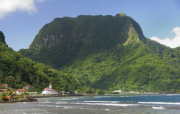 One of the seven National Natural Landmarks located on the opposite side of Pago Pago Harbor, Rainmaker Mountain is a great mass of volcanic rocks extruded as molten magma during major episodes of volcanism that created Tutuila Island in American Samoa. Photo courtesy of the US National Park Service.