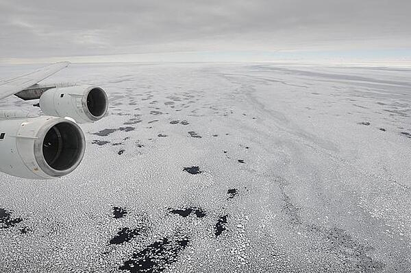 Sea ice is seen out the window of NASA's DC-8 research aircraft as it flies 600 m (2,000 ft) above the Bellingshausen Sea in West Antarctica. Photo courtesy of NASA.