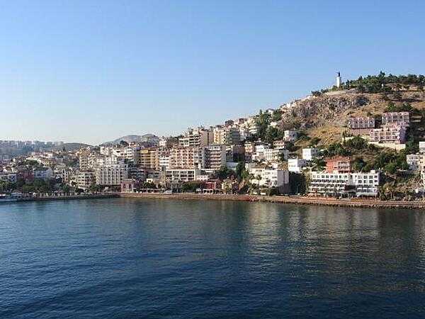 View of the port of Kusadasi on the Aegean Sea. The name Kusadasi means &quot;Bird Island.&quot; In Byzantine times it was called &quot;Ephesus Neopolis&quot; and &quot;Scala Nova&quot; under the Genoese and Venetians. Its current name was officially adopted at the beginning of the 20th century by Turkish authorities. Kusadasi is the gateway to the Roman ruins at Ephesus. Some 95 km (57 mi) south of Izmir, it has grown since the late 1970s from a fishing village into a major tourist center serving thousands of tourists. A statue of Kemal Ataturk, the first president of Turkey and the founder of the Turkish Republic, stands on a hill overlooking the city.