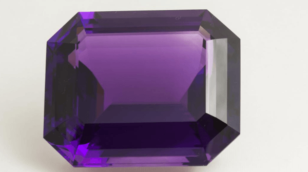 Amethyst is the most valuable gem variety of quartz, one of the most abundant minerals on earth. Quartz is normally colorless, but when iron replaces some of the stone's silicon, the result is a purple stone. In Roman mythology, the god of wine made amethyst purple to offer protection against drunkenness, and the stone’s name derives from the Greek word meaning “not to intoxicate.” Most gem-quality amethyst is found in Brazil and Uruguay. The amethyst pictured here was mined in Brazil and weighs 401.52 carats. (Photo courtesy of Smithsonian Museum of Natural History/ Ken Larsen)