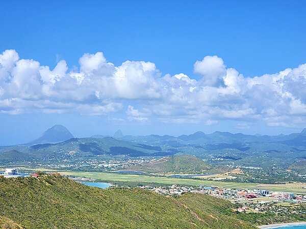 A view of Vieux Fort, the southernmost town on Saint Lucia and the site of the island's airport. The Twin Pitons, on the southwestern shore of Saint Lucia, can be seen in the distance.