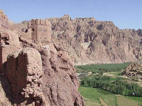 View from Shahr-i-Zohok (the &quot;Red City&quot;) in Bamyan Province in Afghanistan. Once a citadel housing about 3,000 people, it was destroyed by the Mongols in the 13th century. The invaders also leveled the nearby city that the fortress had protected and  massacred all its inhabitants (possibly 150,000) and animals. In memory, the site is today known as Shahr-i-Gholghola (the &quot;City of Screams&quot;).