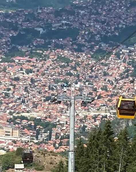 A view of Sarajevo from one of the cable cars that connects the old section of the city with Trebevic Mountain. The original cable car system was built and opened in 1959 but was completely destroyed during the Bosnian War (1992-95). In 2018, the Trebevic Cable Car was officially re-opened as a modernized, faster, and larger system, still crossing the border between the Federation of Bosnia and Herzegovina and the Republika Srpska.