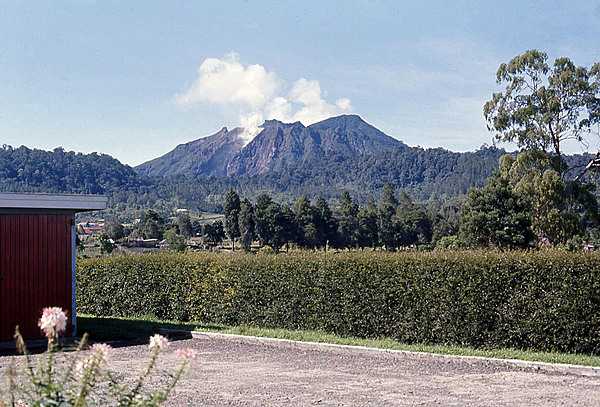 The photo shows a dormant but smoking volcano on the island of Sumatra in Indonesia. The archipelago of Indonesia lies on the Pacific Ring of Fire, where the Indo-Australian Plate and the Pacific Plate are pushed under the Eurasian Plate and melt around 100 km (62 mi) below the Earth's surface. Indonesia has about 150 active volcanoes, the most of any country on earth.