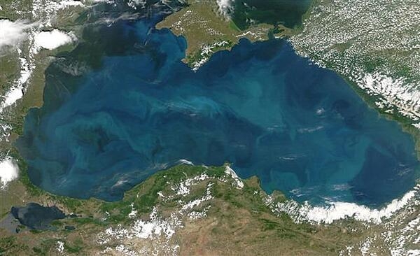 Swirls of color ranging from deep olive green to bright turquoise were created by a massive phytoplankton bloom that covered the entire surface of the Black Sea on this image taken 20 June  2006. Many of Europe&apos;s largest rivers, including the Danube, the Dnister, and the Dnipro (Dnieper) dump fresh water into the sea. The sea&apos;s only source of salty water is the narrow Bosporus Strait, which connects it to the Mediterranean Sea through the Sea of Marmara. Photo courtesy of NASA.
