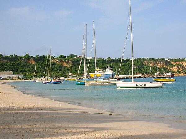 Sailboats at Sandy Ground before the annual Carnival Boat Race. Every year Anguilla holds a two-week-long celebration of Emancipation Day (beginning of August). While the island hosts many boat races throughout the year, the Champion of Champions Race during this celebration is the culminating event. Boaters from many neighboring islands, as well as from Anguilla, start in Sandy Ground and end in Island Bay. Spectators, nicknamed landracers, gather on the beaches to watch and picnic.