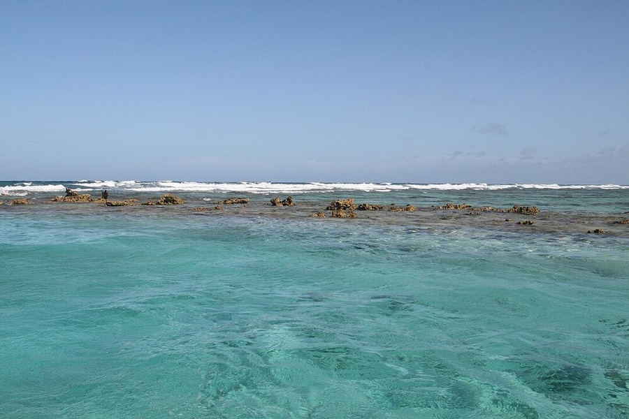 Belize is home to the second largest coral reef system in the world, after the Great Barrier Reef in Australia. The Belize Barrier Reef is a series of coral reefs 300 km (190 mi) long that became a UNESCO site in 1996. It is Belize's top tourist destination and important to the country’s fishing industry.