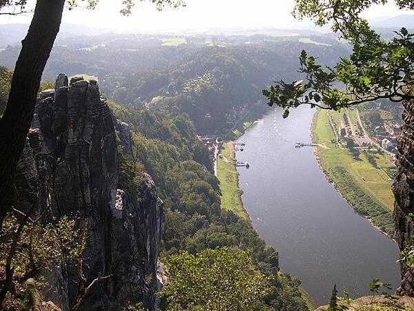 A view showing the town of Rathen, Germany, on the Elbe River. Niederrathen (Lower Rathen) on the left connects to Oberrathen (Upper Rathen) on the right by ferry.