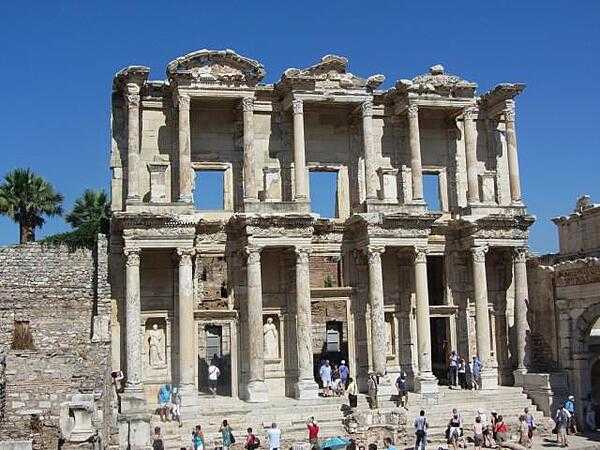 The Library of Celsus in Ephesus was built between A.D. 100 and 110 by Gaius Julius Aquila in memory of his father, Tiberius Julius Celsus Polemaneanus, a former governor of Roman Asia, who is buried under the library. The library held 1,200 scrolls and was built facing east to make the best use of morning light; it was destroyed by an earthquake in A.D. 270. The facade was reconstructed between 1970 and 1978.