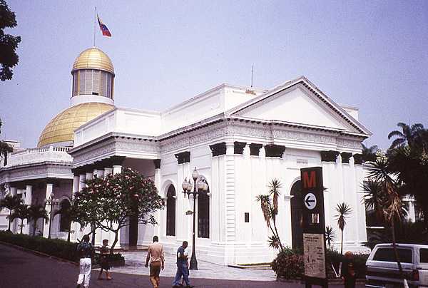 The distinctive double-domed Federal Legislative Palace in Caracas houses the unicameral National Assembly. The Asamblea Nacional, expanded in 2020, now consists of 277 seated members, with three of the seats reserved for indigenous peoples.