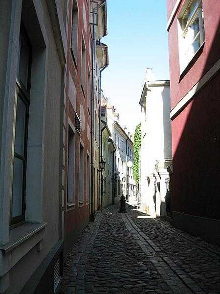 Morning sunlight illuminates an alley in Riga, Latvia.