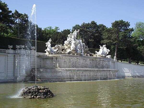 The Neptune Fountain on the grounds of Schoenbrunn Palace in Vienna, Austria.