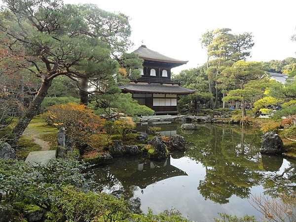 Ginkaku-ji, or "Temple of the Silver Pavilion," is a Zen Buddhist temple in the Sakyo ward of Kyoto. This fall scene shows the structure reflected in its adjacent pool.